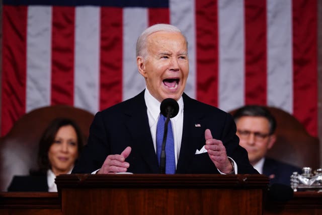 <p>US President Joe Biden delivers his third State of the Union address as Vice President Kamala Harris and Speaker of the House Mike Johnson look on </p>