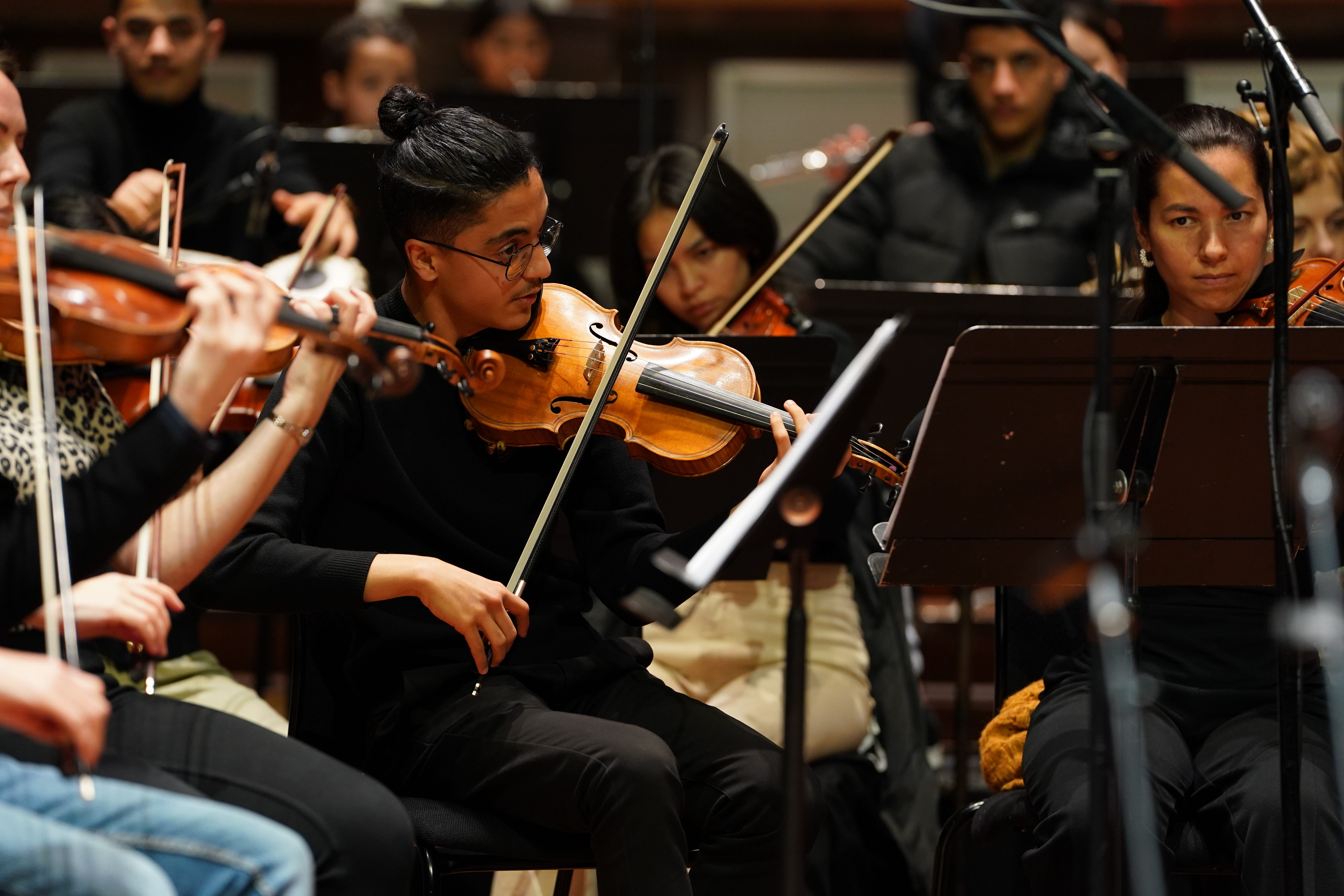 Members of the Afghan Youth Orchestra practice for their Breaking the Silence tour at London’s Southbank Centre (Lucy North/PA)