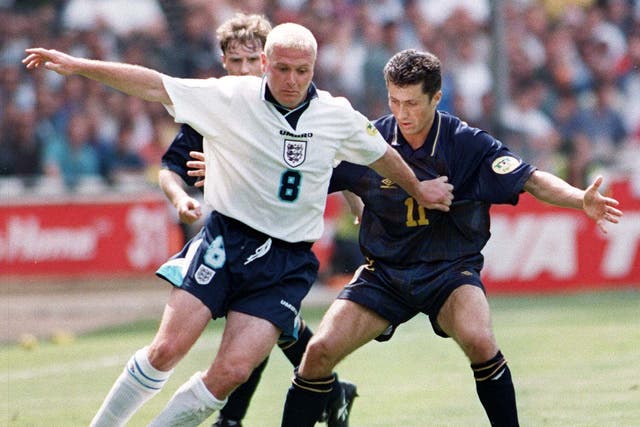 <p>Gascoigne holds off Scotland’s John Collins during the Euro 96 clash at Wembley</p>