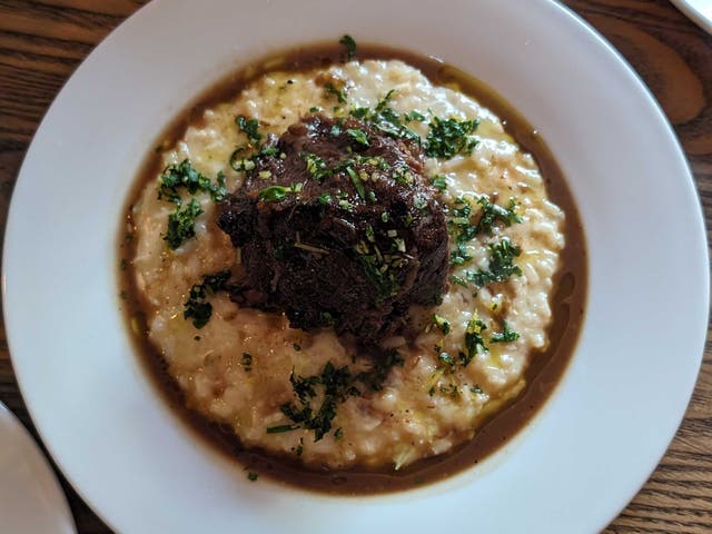 <p>Small the restaurant might be, but the portions are not. Pictured: braised ox cheek, risotto, salsa verde </p>