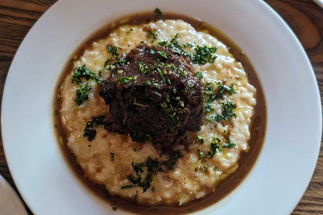 <p>Small the restaurant might be, but the portions are not. Pictured: braised ox cheek, risotto, salsa verde </p>