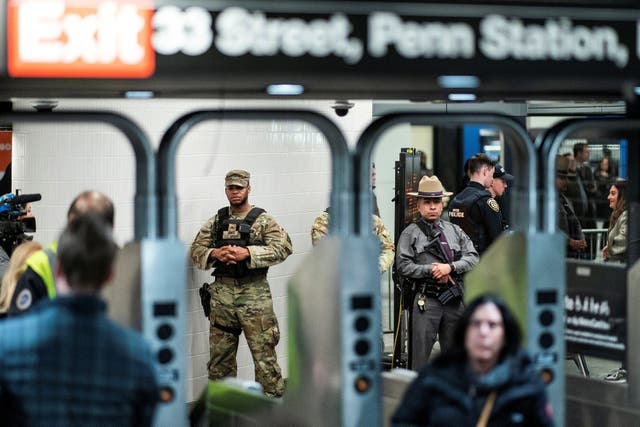 <p>National Guard troops and New York State Police officers patrol Penn Station in New York City on 7 March. </p>