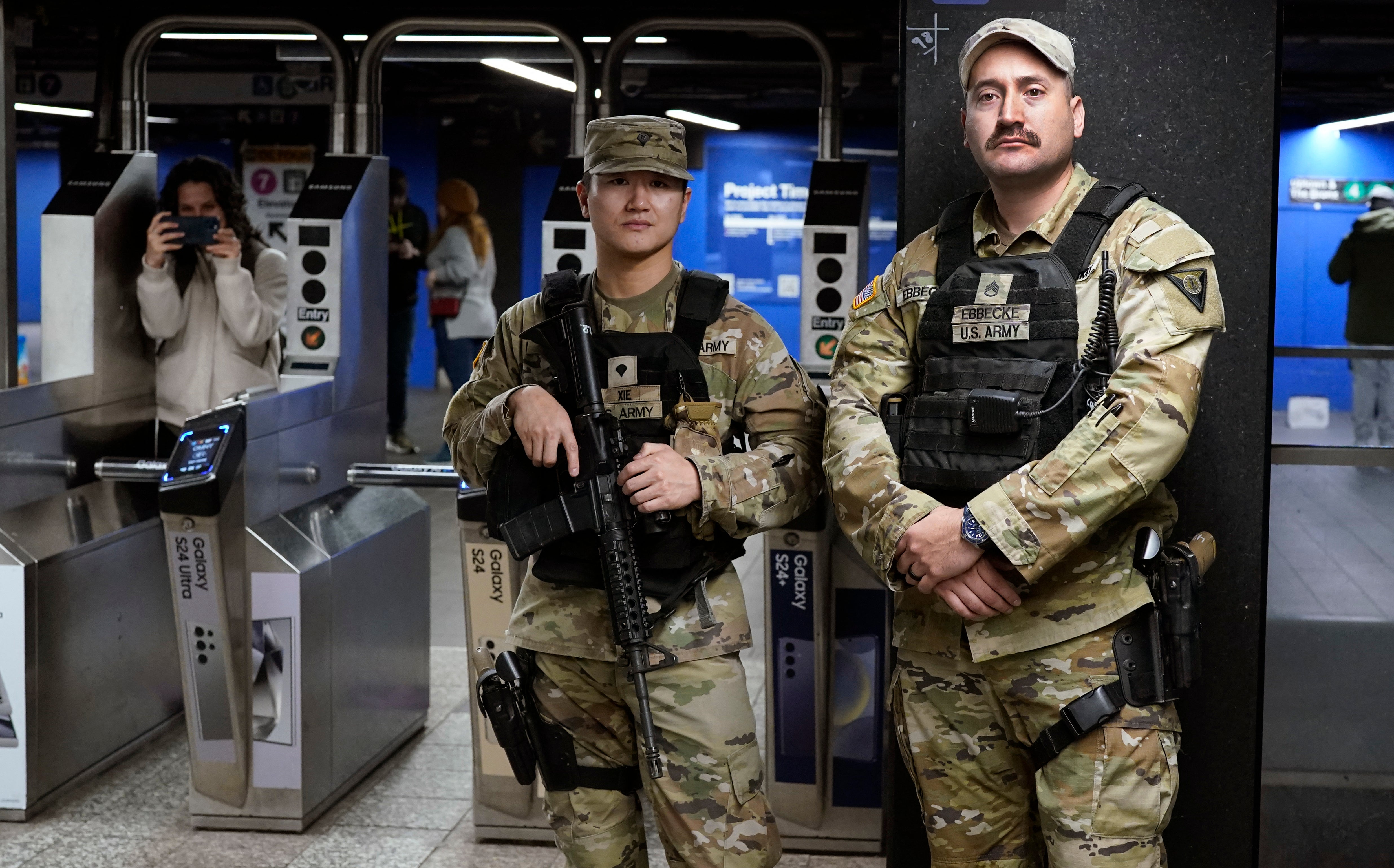 Members of the US Army National Guard stand watch at Grand Central Terminal in New York City on 7 March.