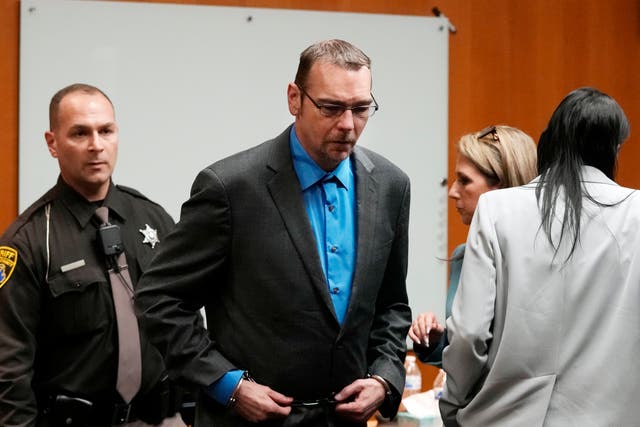 <p>James Crumbley is escorted from the Oakland County courtroom 8 March 2024, in Pontiac, Michigan</p>