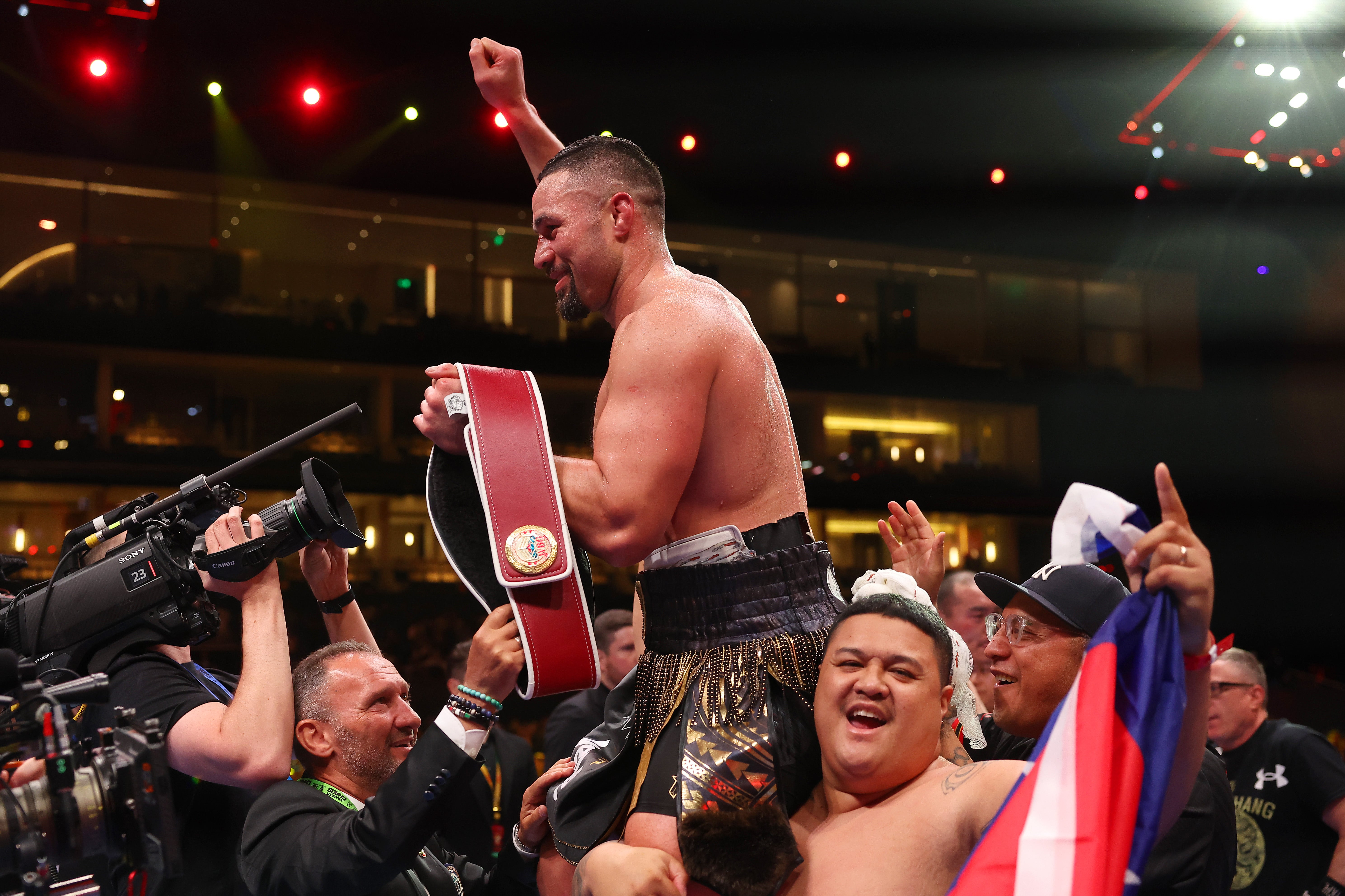 Joseph Parker celebrates victory with the title belt following the WBO Interim World Heavyweight bout