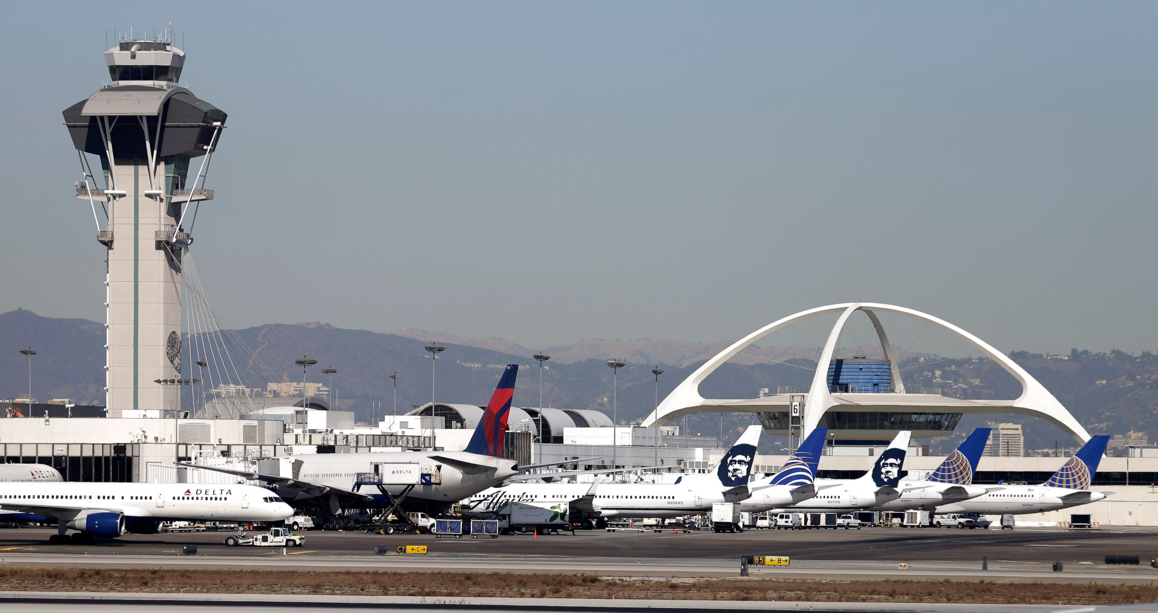 Airplanes sit on the tarmac at Los Angeles International Airport