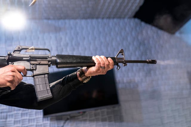 <p>Two empty shell casings fly as a fully automatic M-16 is fired at the Bureau of Alcohol, Tobacco, Firearms, and Explosives (ATF), National Services Center</p>