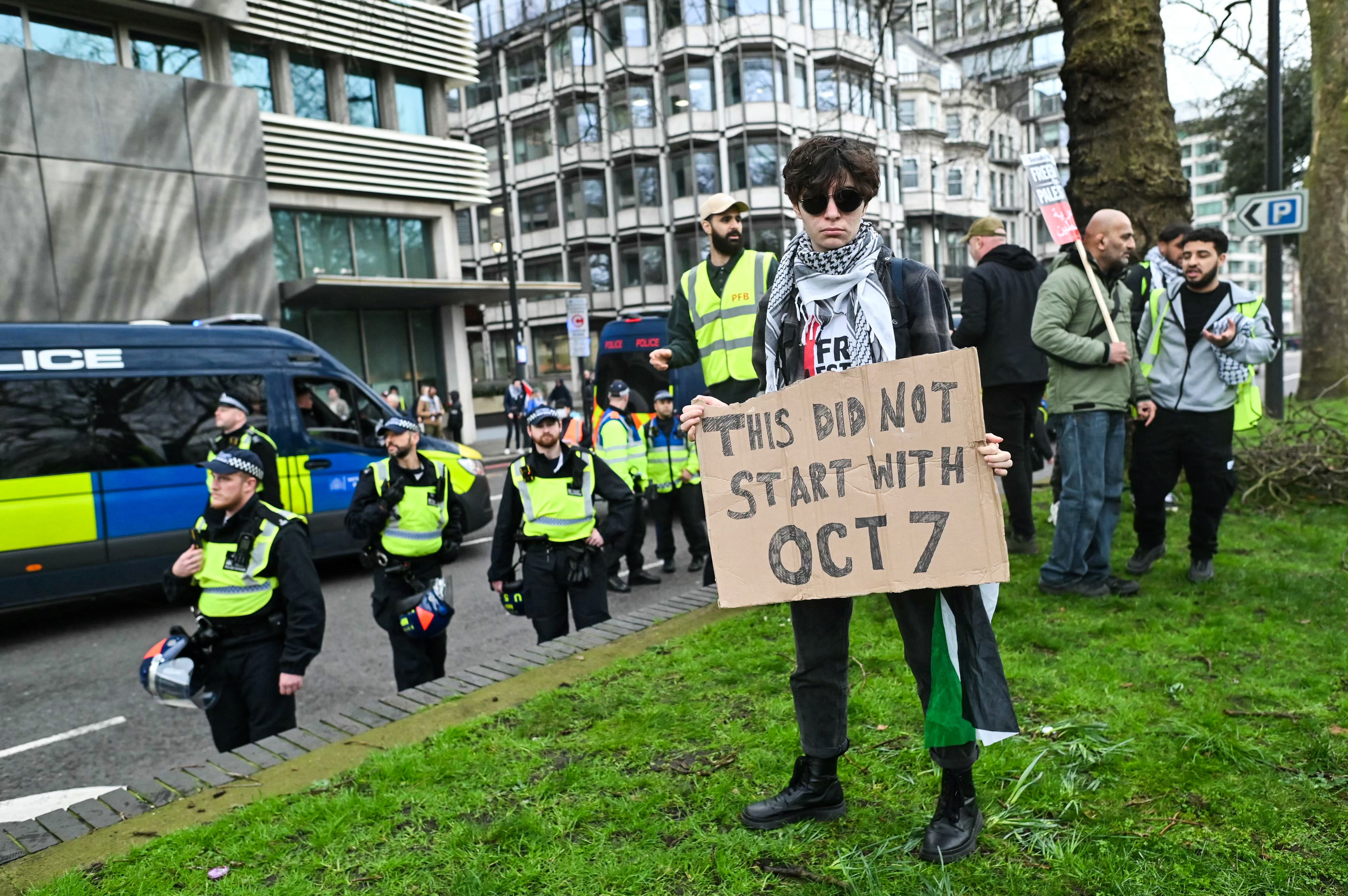 You’d better move on: police keep a watchful eye over a protester at the National March for Palestine in London last month