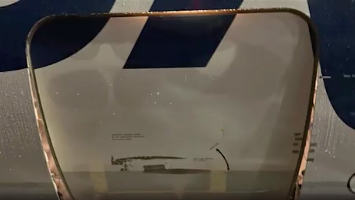 Alaska Airlines flight carrying pets arrives with cargo door open