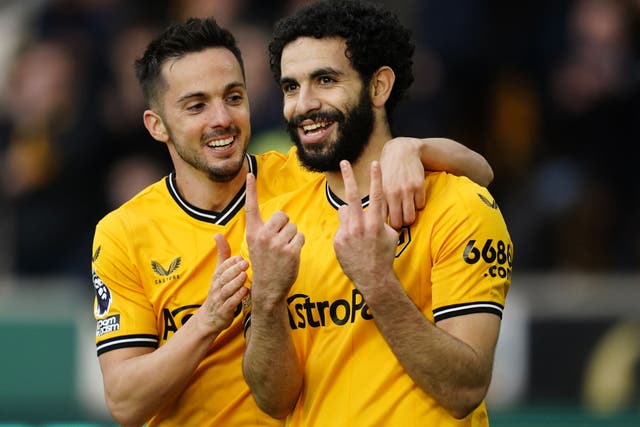 Rayan Ait-Nouri, right, celebrates scoring Wolves’ opener (Nick Potts/PA)