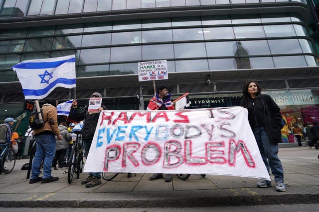 <p>A protest against the weekly pro-Palestine rallies in central London (Jordan Pettitt/PA)</p>