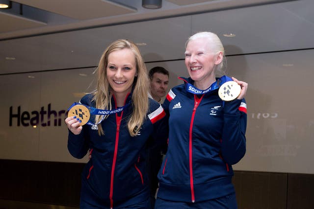 Charlotte Evans, left, and Kelly Gallagher show off their goal medals from the 2014 Winter Paralympics (Steve Parsons/PA)