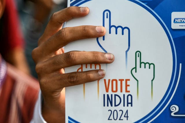 <p>A student holds a placard during a rally to create awareness about the importance of voting ahead of the upcoming general elections, in Chennai on March 9, 2024</p>