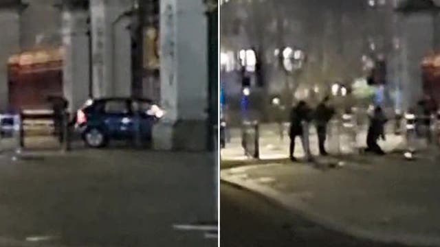 <p>Car crashes into Buckingham Palace gates as loud bang heard</p>