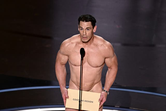 <p>John Cena presents the award for Best Costume Design onstage during the 96th Annual Academy Awards</p>