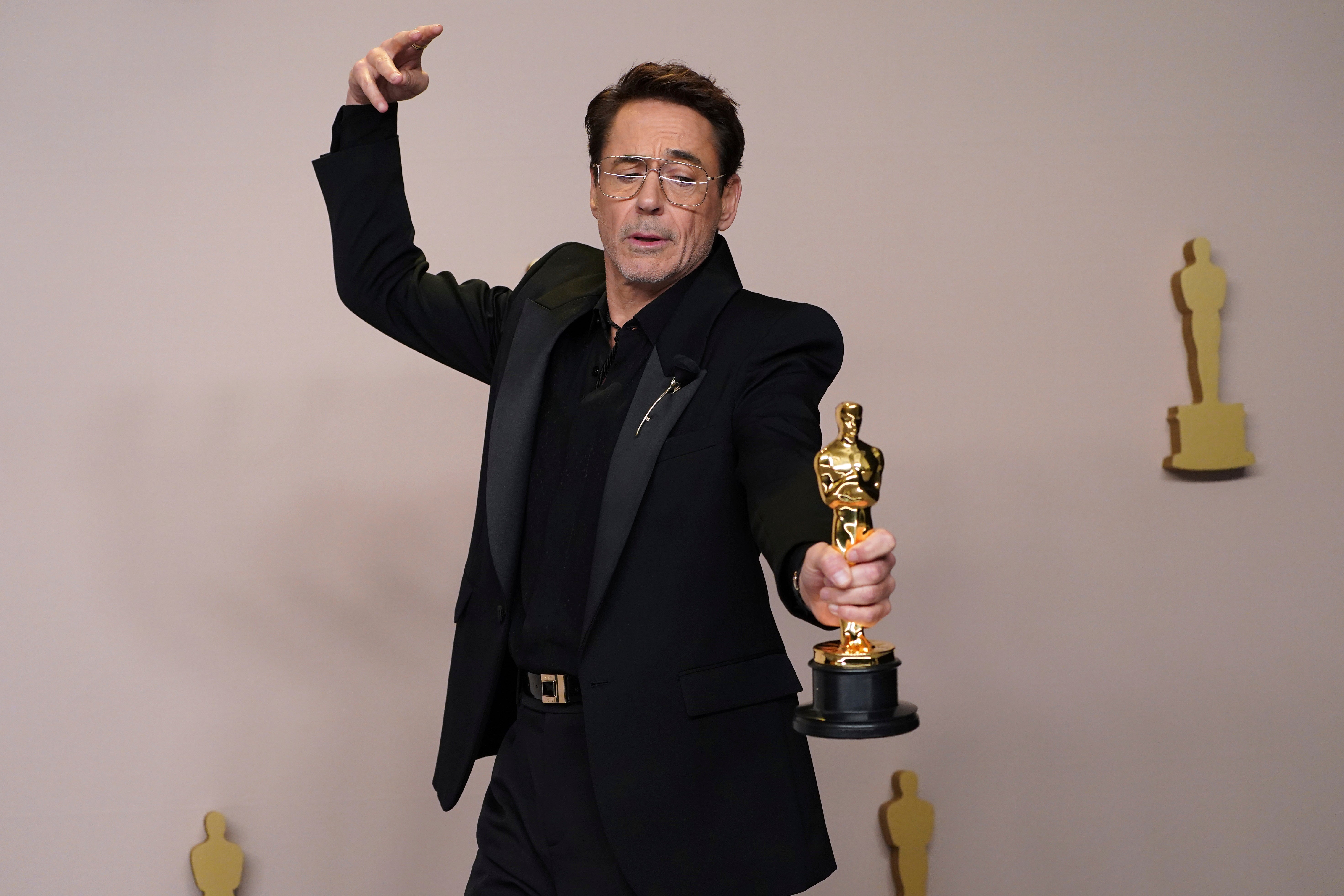 Downey Jr poses with his Oscar