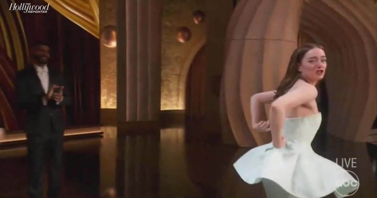 Emma Stone suffers dress mishap before sobbing as she accepts