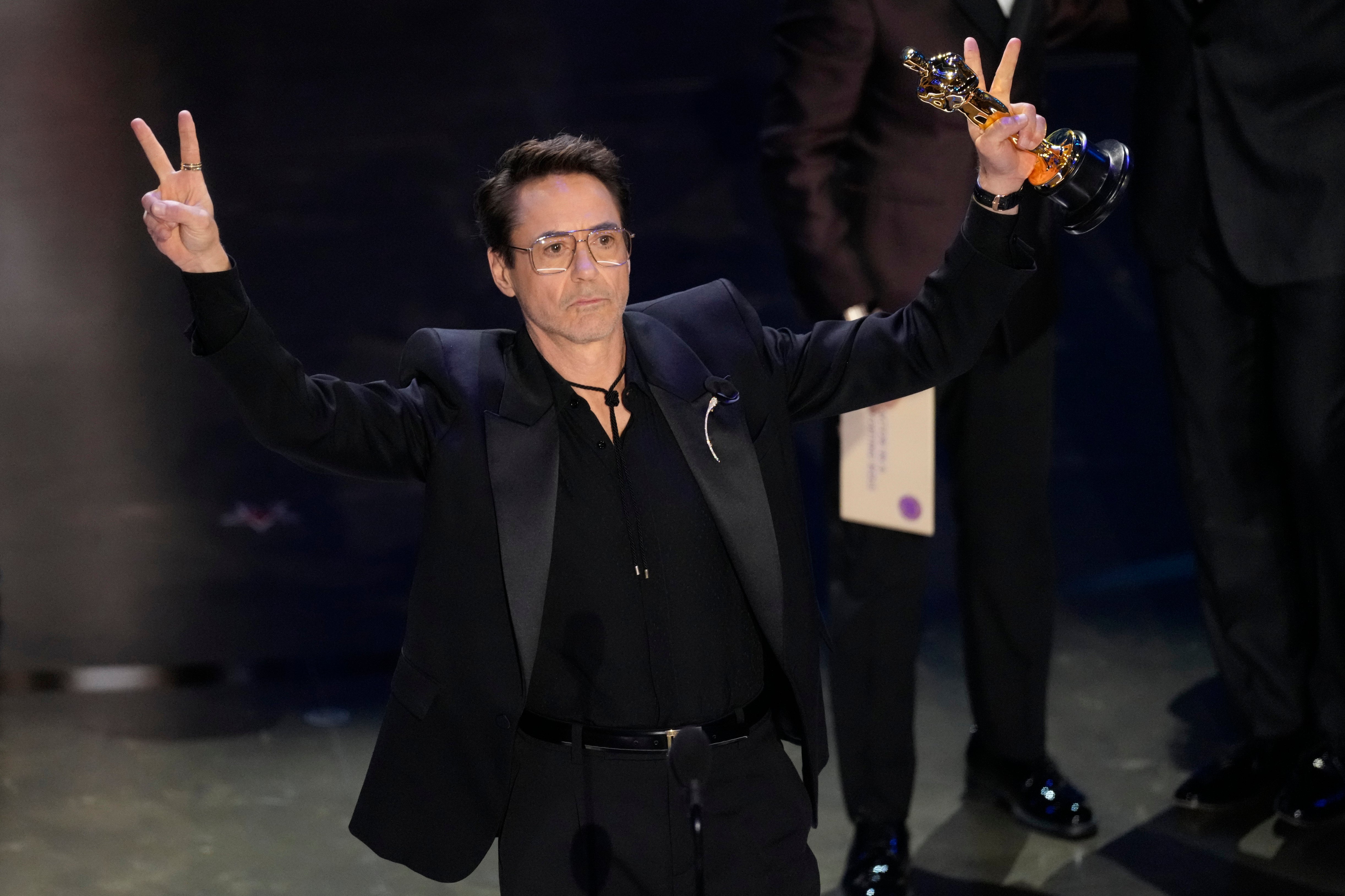 Robert Downey Jr. accepts the award for best performance by an actor in a supporting role for ‘Oppenheimer’