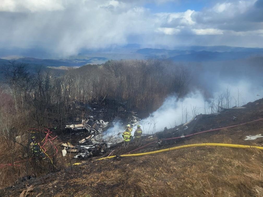 Emergency crew work at the site of a business jet crash in Hot Springs, Bath County, Virginia