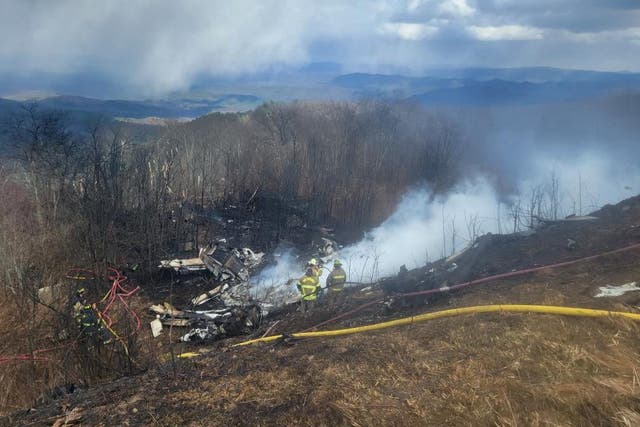 <p>Emergency crew work at the site of a business jet crash in Hot Springs, Bath County, Virginia</p>