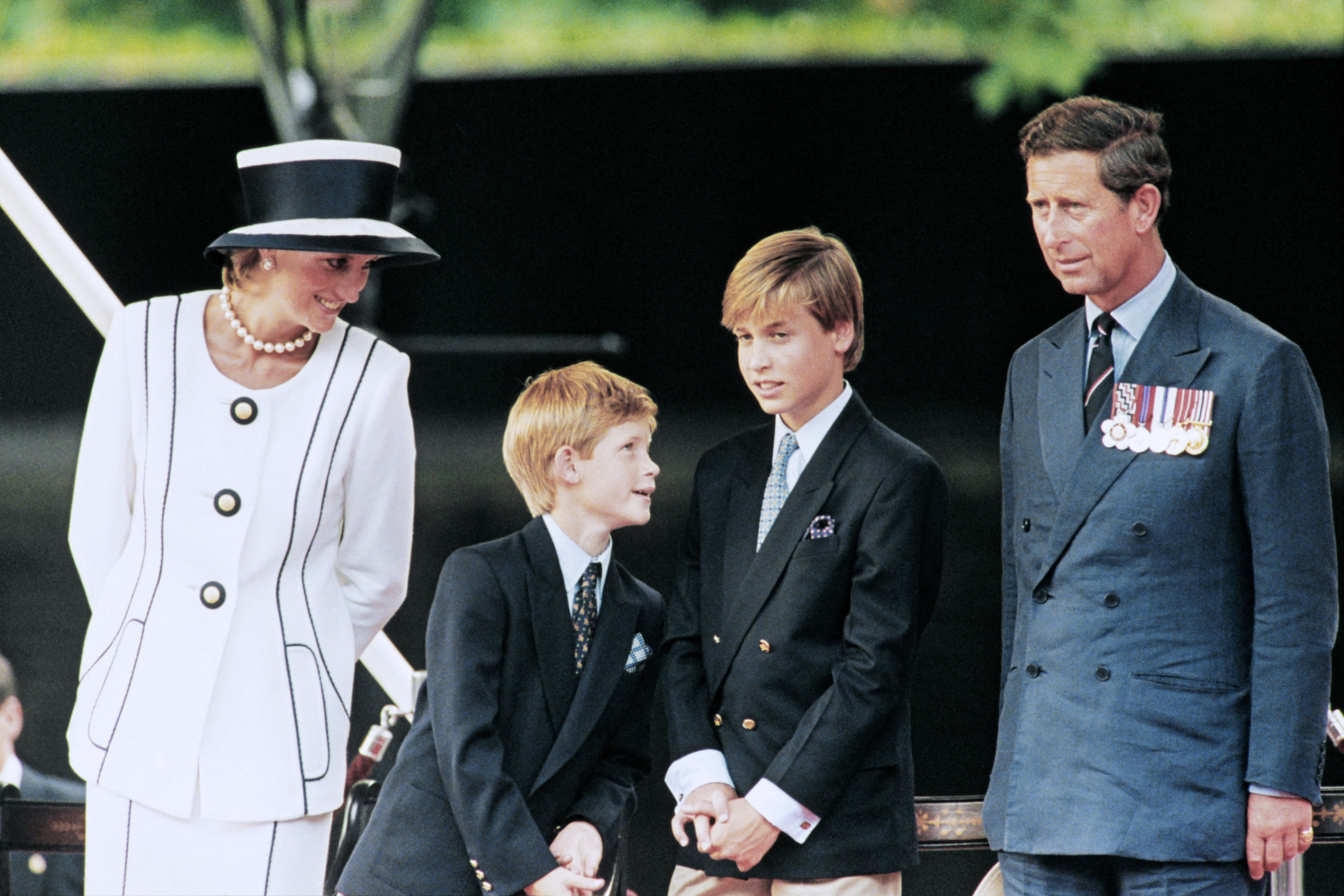 Princess Diana with Princes William and Harry, and King Charles