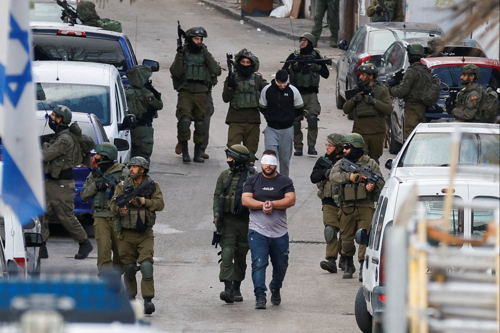 Israeli soldiers detain Palestinians during a raid, in Ramallah last week