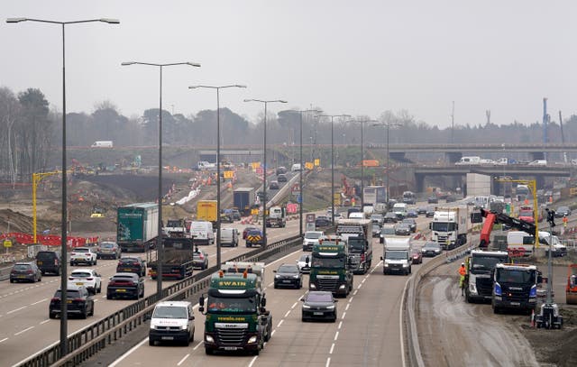 <p>A view of traffic approaching junction 10 of the M25 in Surrey during a site visit </p>