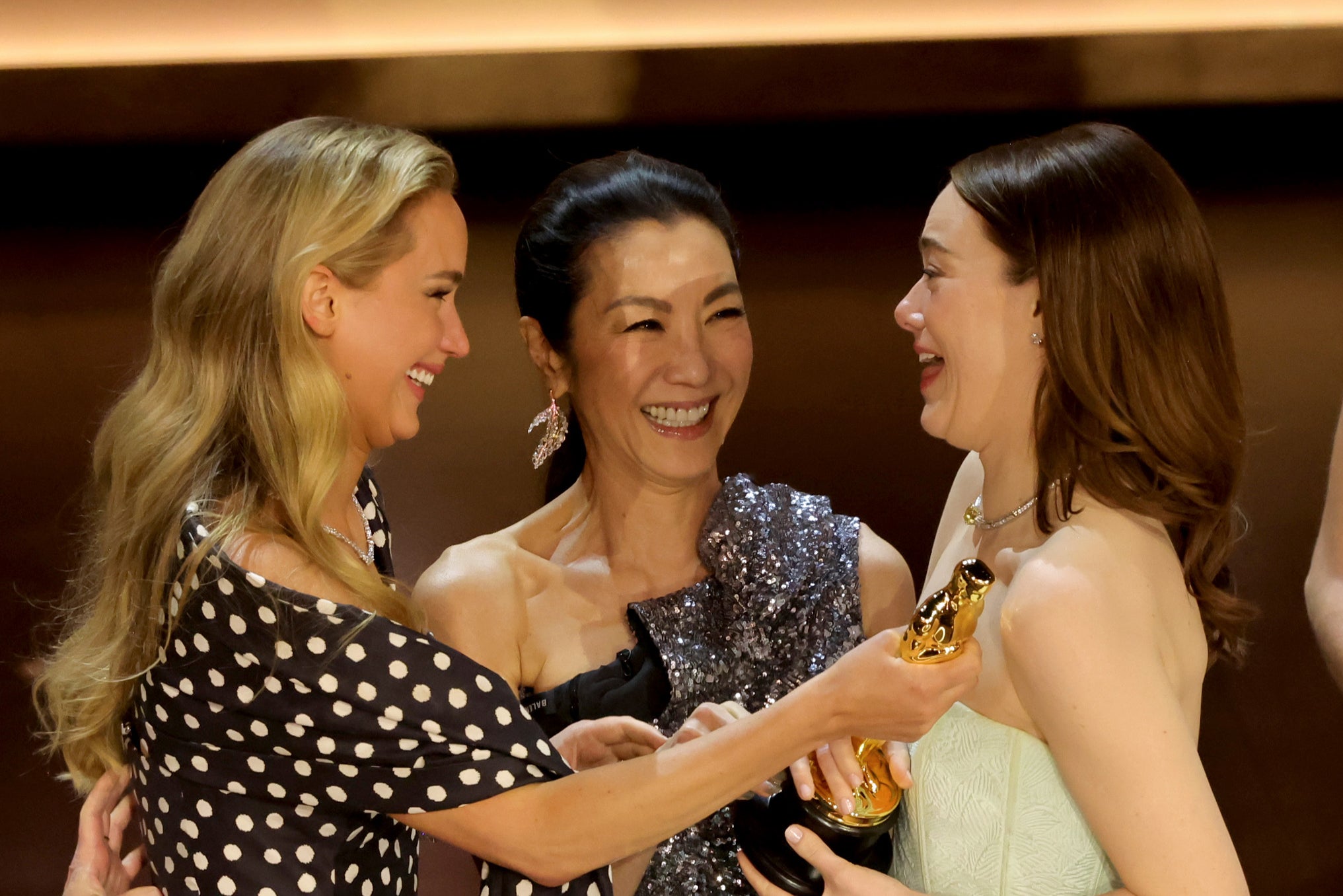 Jennifer Lawrence, Michelle Yeoh and Emma Stone (l-r) onstage at the Oscars 2024