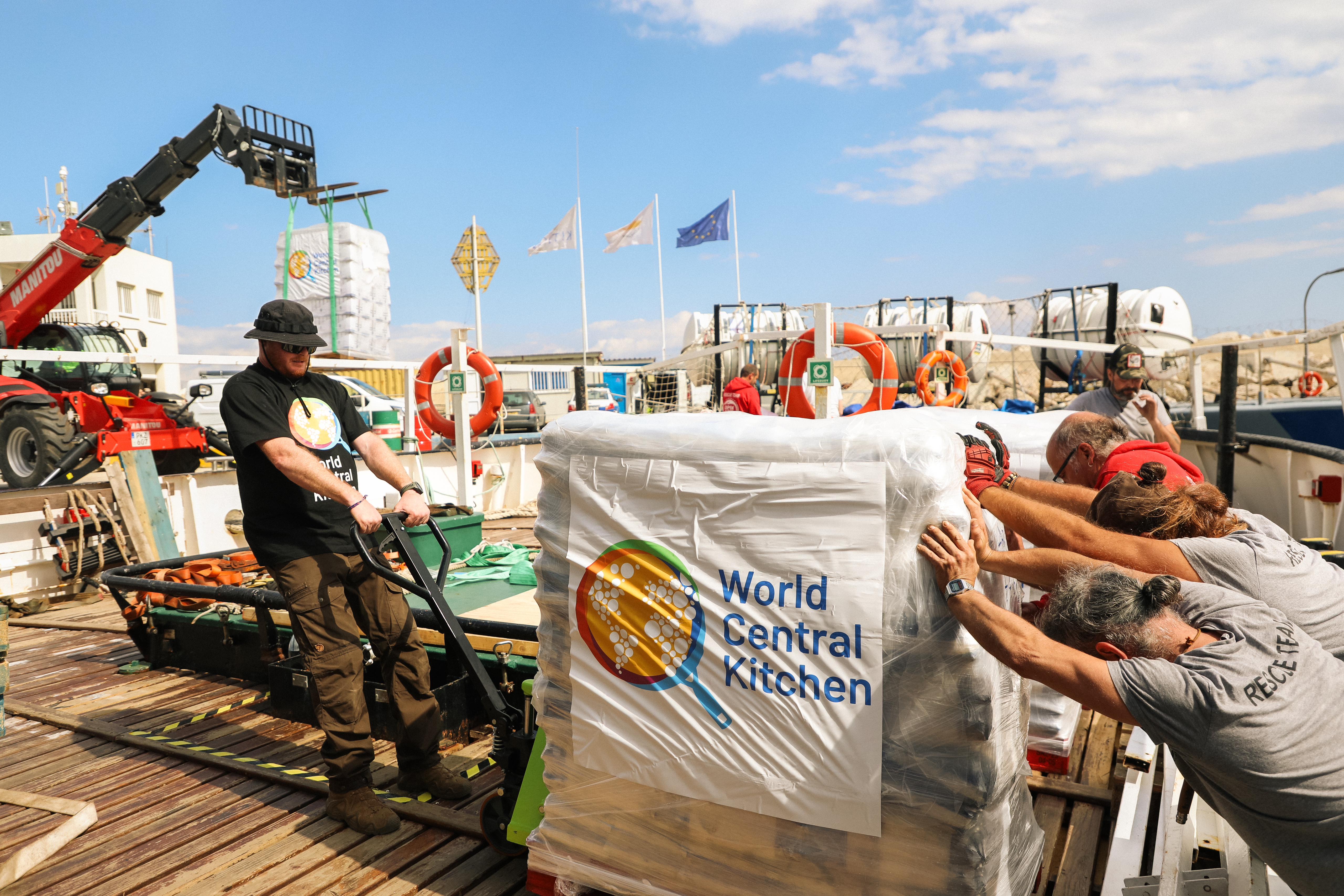 World Central Kitchen staff load Open Arms boat with aid for Gaza