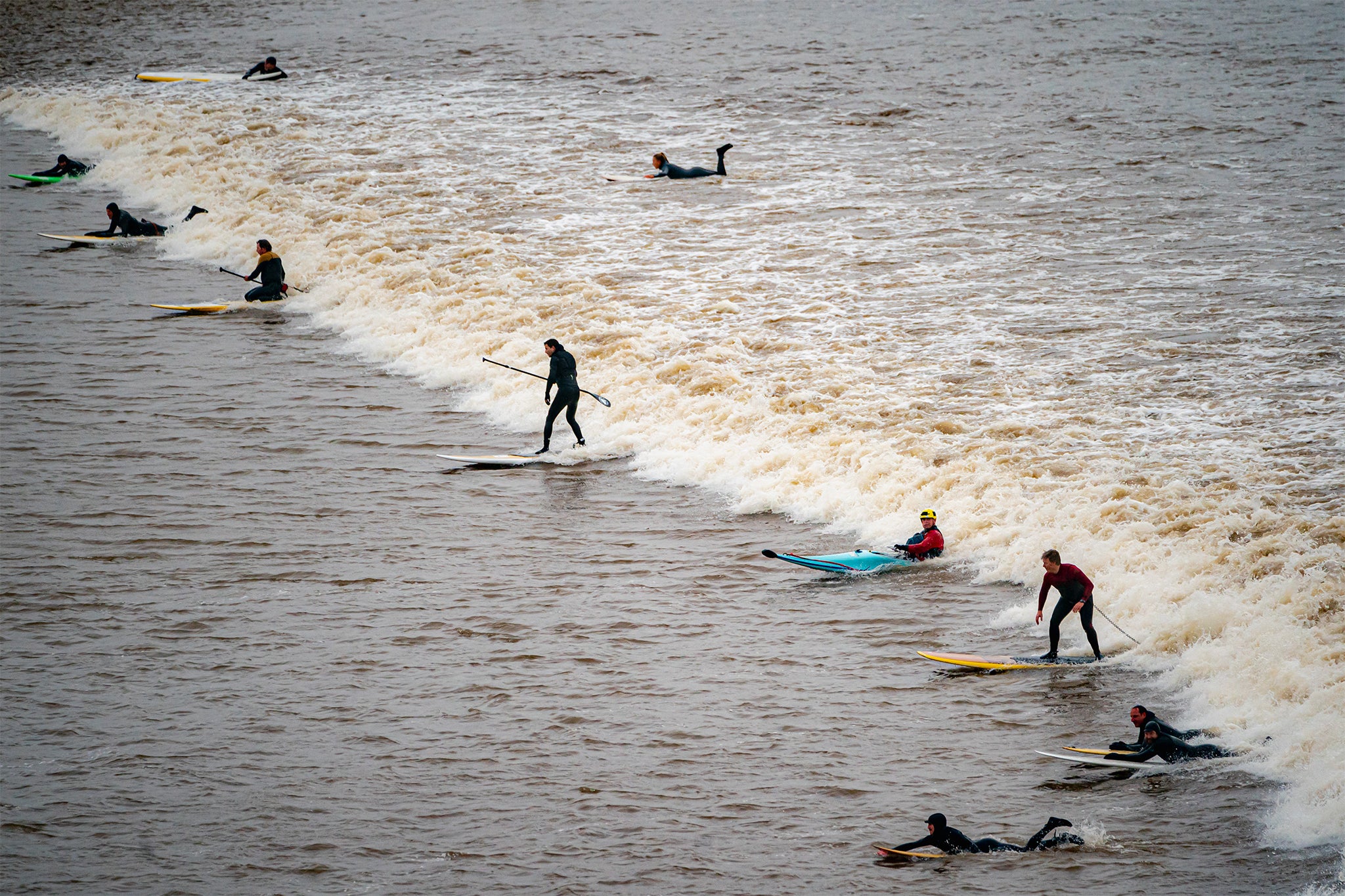 Surfers enjoy the unique event on Tuesday morning