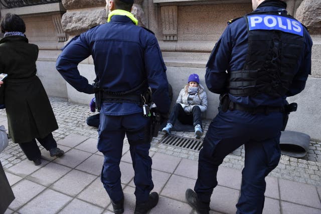 <p>Climate activist Greta Thunberg attends a protest outside the Swedish parliament in Stockholm, Sweden, Tuesday, March 12, 2024. She was later dragged away by police</p>