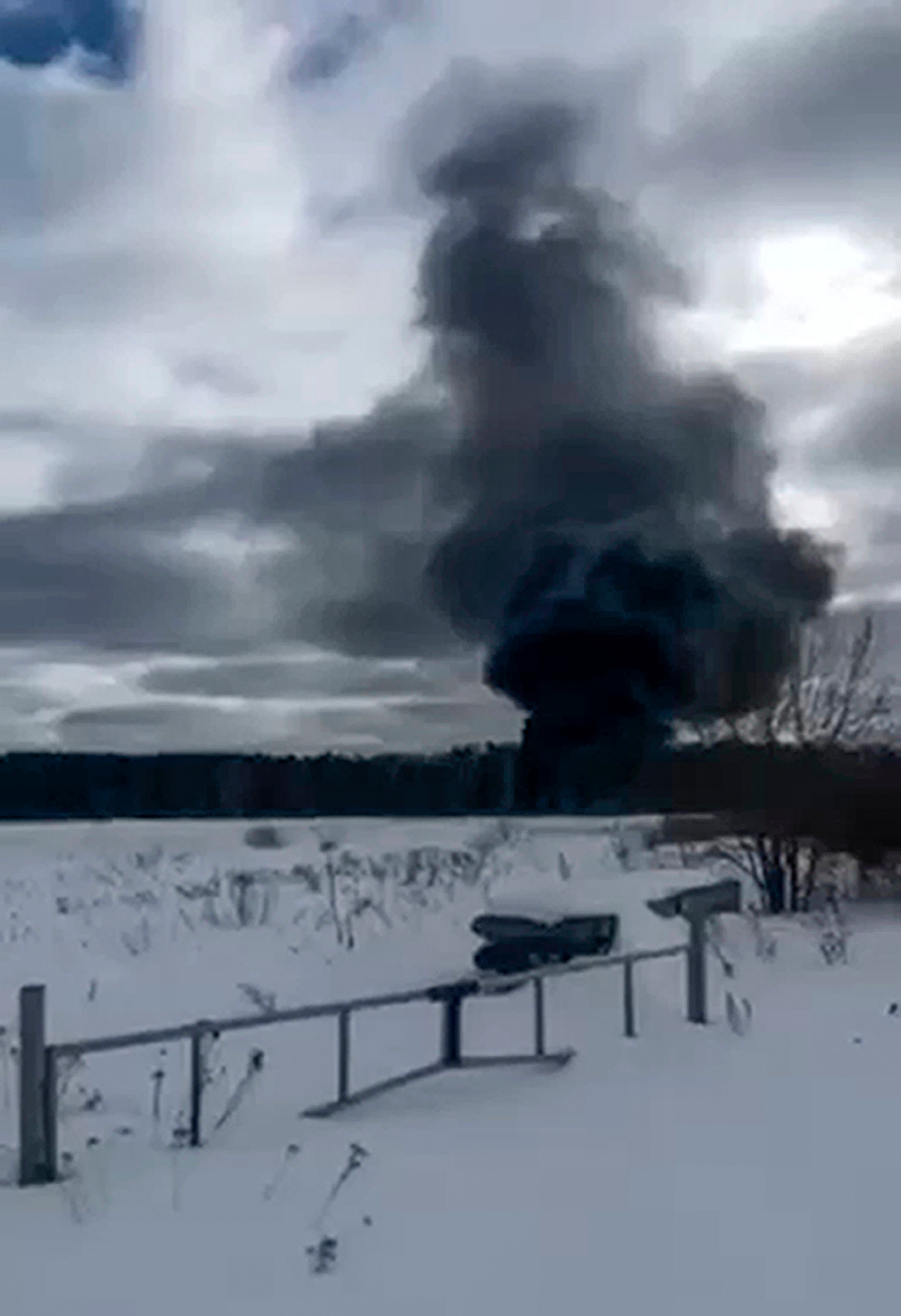 Smoke rises from a crashed Russian military Il-76 transport plane outside Ivanovo, Russia