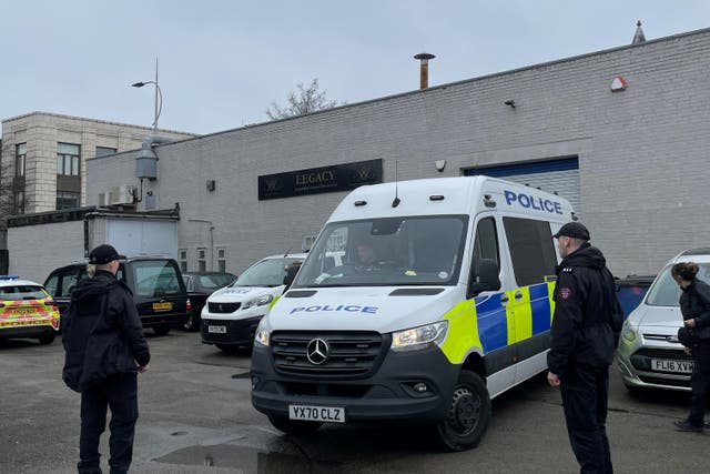 Police outside the Hessle Road branch of Legacy Independent Funeral Directors in Hull (Dave Higgens/PA)