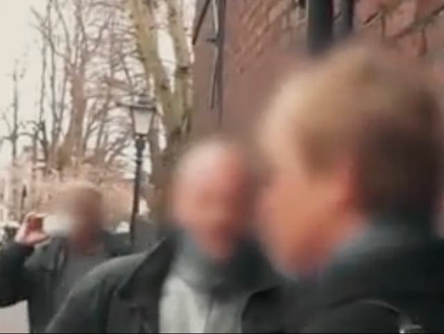 <p>Video footage has captured the moment an angry mob of conspiracy theorists chased innocent parents and a vicar down the street after they accused them of eating babies.</p>