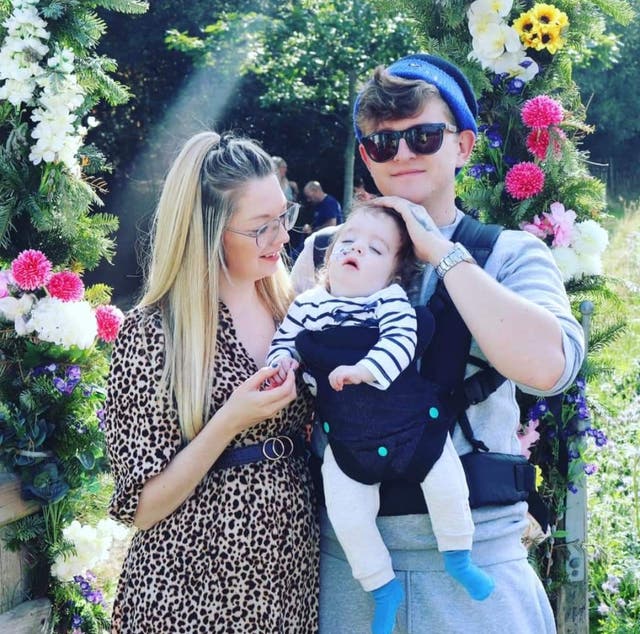 <p>Alice and Lewis Jones with Ronnie, who suffered a catastrophic brain injury during his birth </p>