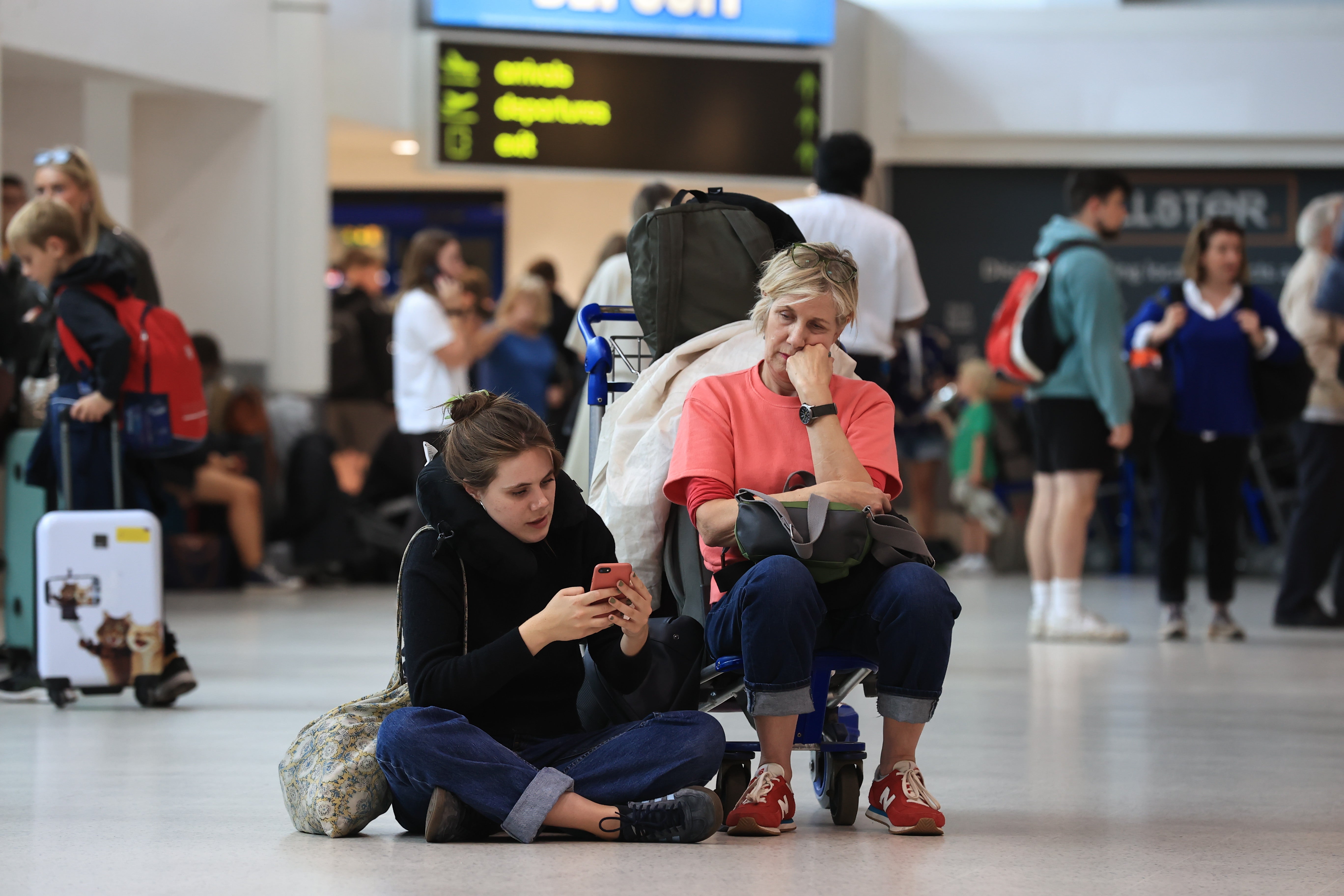 Passengers at Belfast International Airport, as flights to the UK and Ireland were cancelled as a result of air traffic control issues in the UK