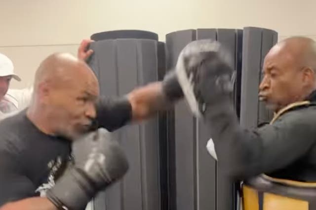 <p>Mike Tyson hitting pads as he prepares to face Jake Paul</p>