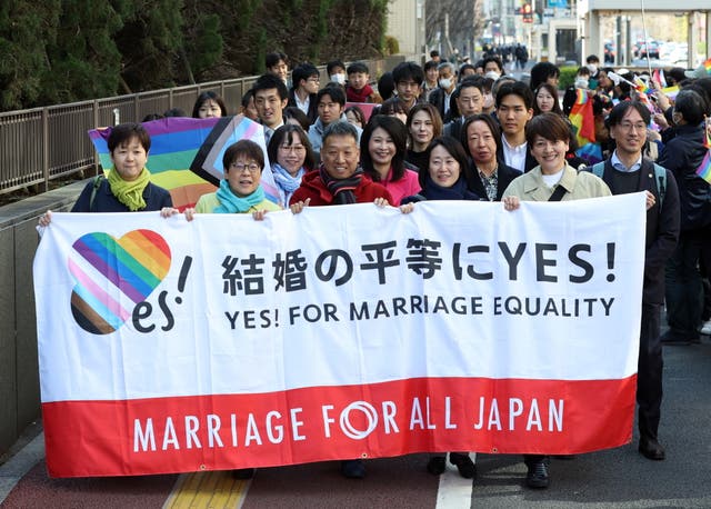<p>Plaintiffs hold a banner before the ruling on same-sex marriage at the Tokyo District Court in Tokyo, Japan</p>