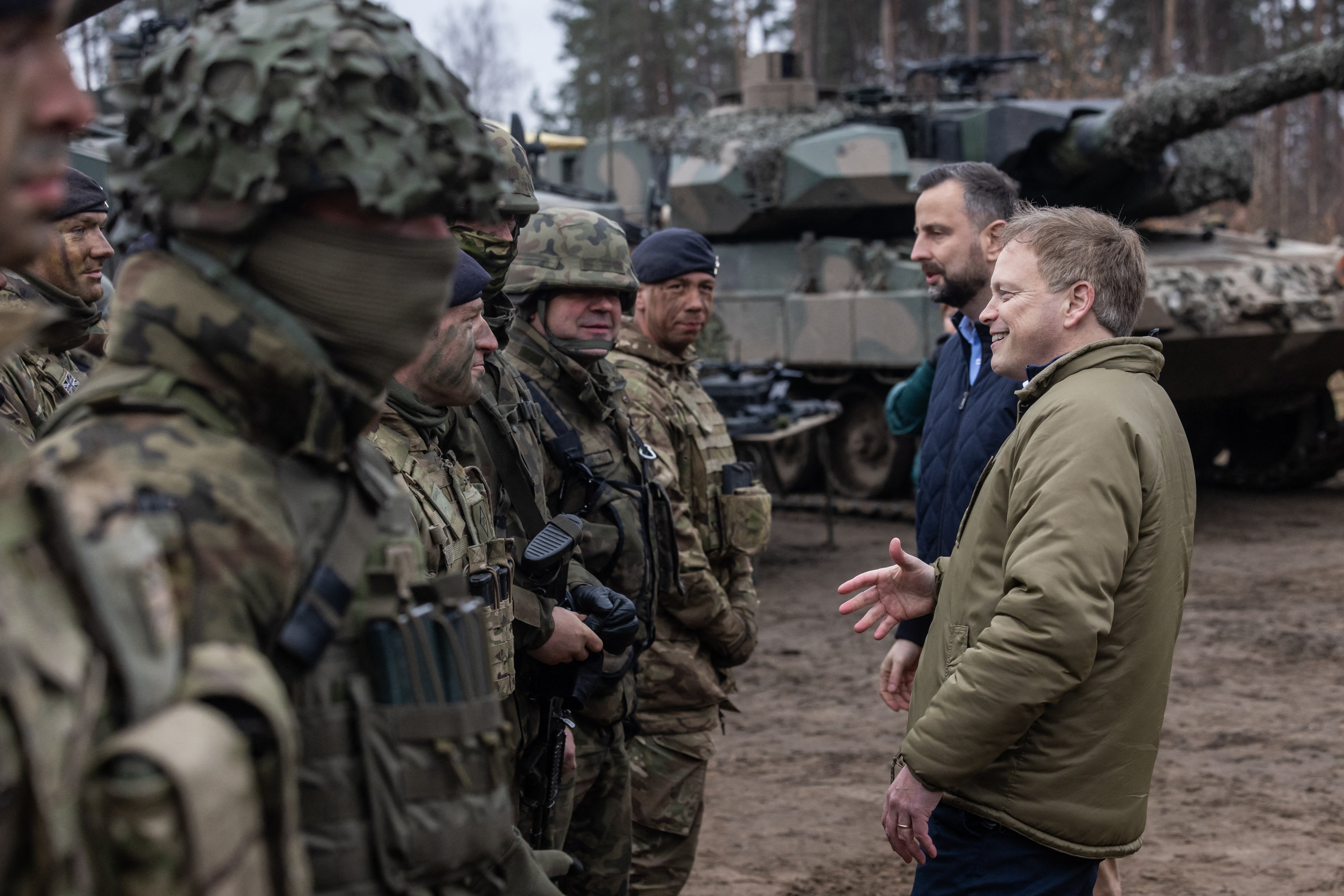 Grant Shapps and Polish defence minister Wladyslaw Kosiniak-Kamysz talk to British and Polish troops on Wednesday
