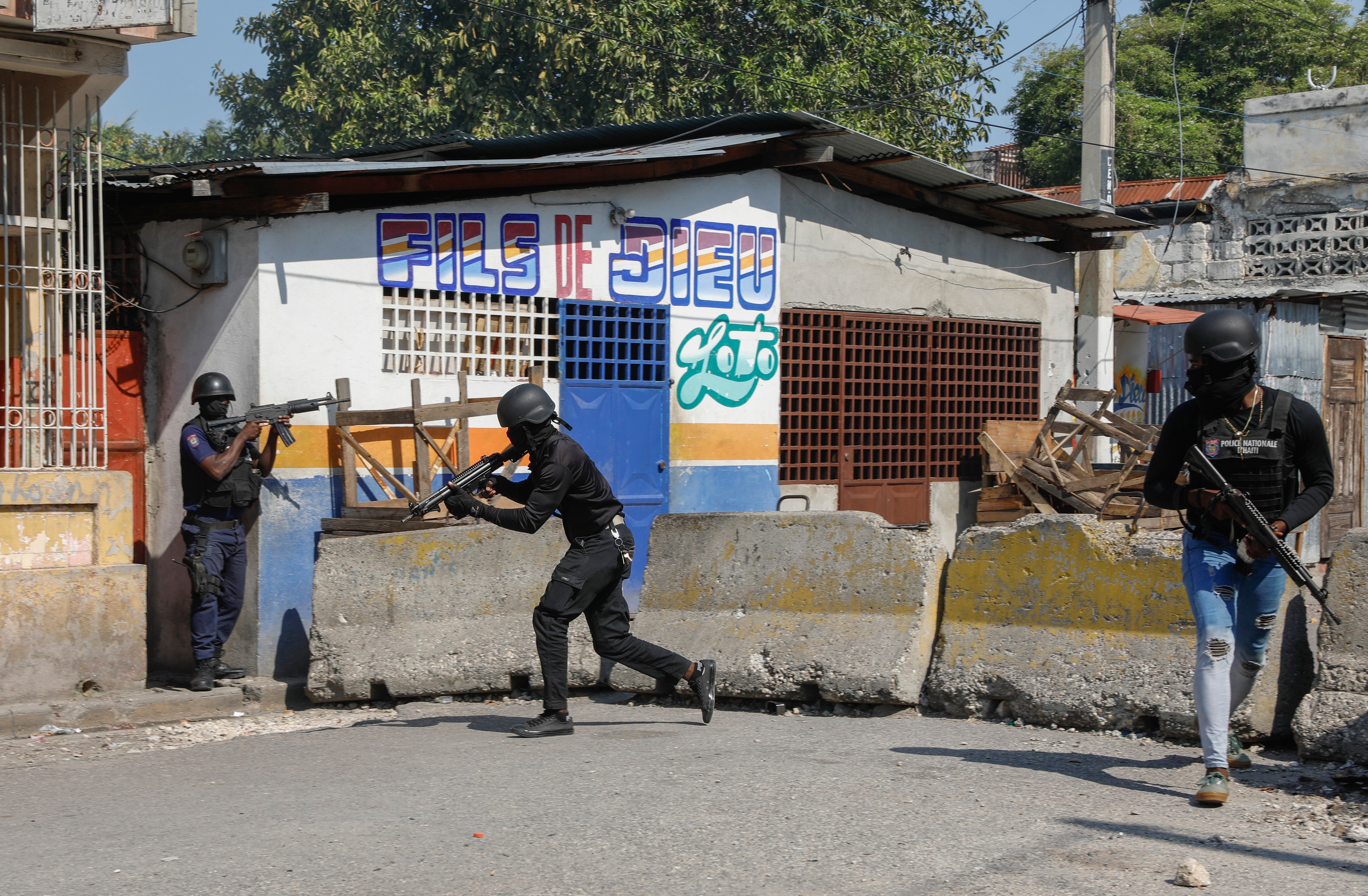 <p>National Police patrol the area near the empty National Penitentiary after a small fire inside the jail in downtown Port-au-Prince, Haiti, Haiti, Thursday, March 14, 2024. </p>