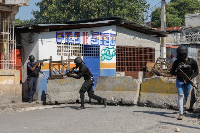 <p>National Police patrol the area near the empty National Penitentiary after a small fire inside the jail in downtown Port-au-Prince, Haiti, Haiti, Thursday, March 14, 2024. </p>