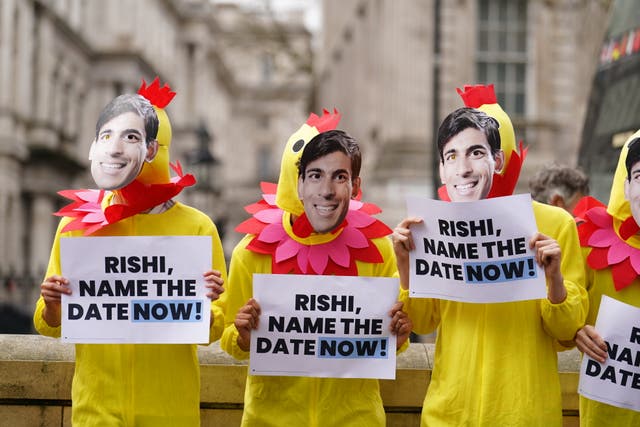 <p>Demonstrators dressed as chickens protest opposite Downing Street as Labour calls on Rishi Sunak to ‘stop squatting’ in office </p>