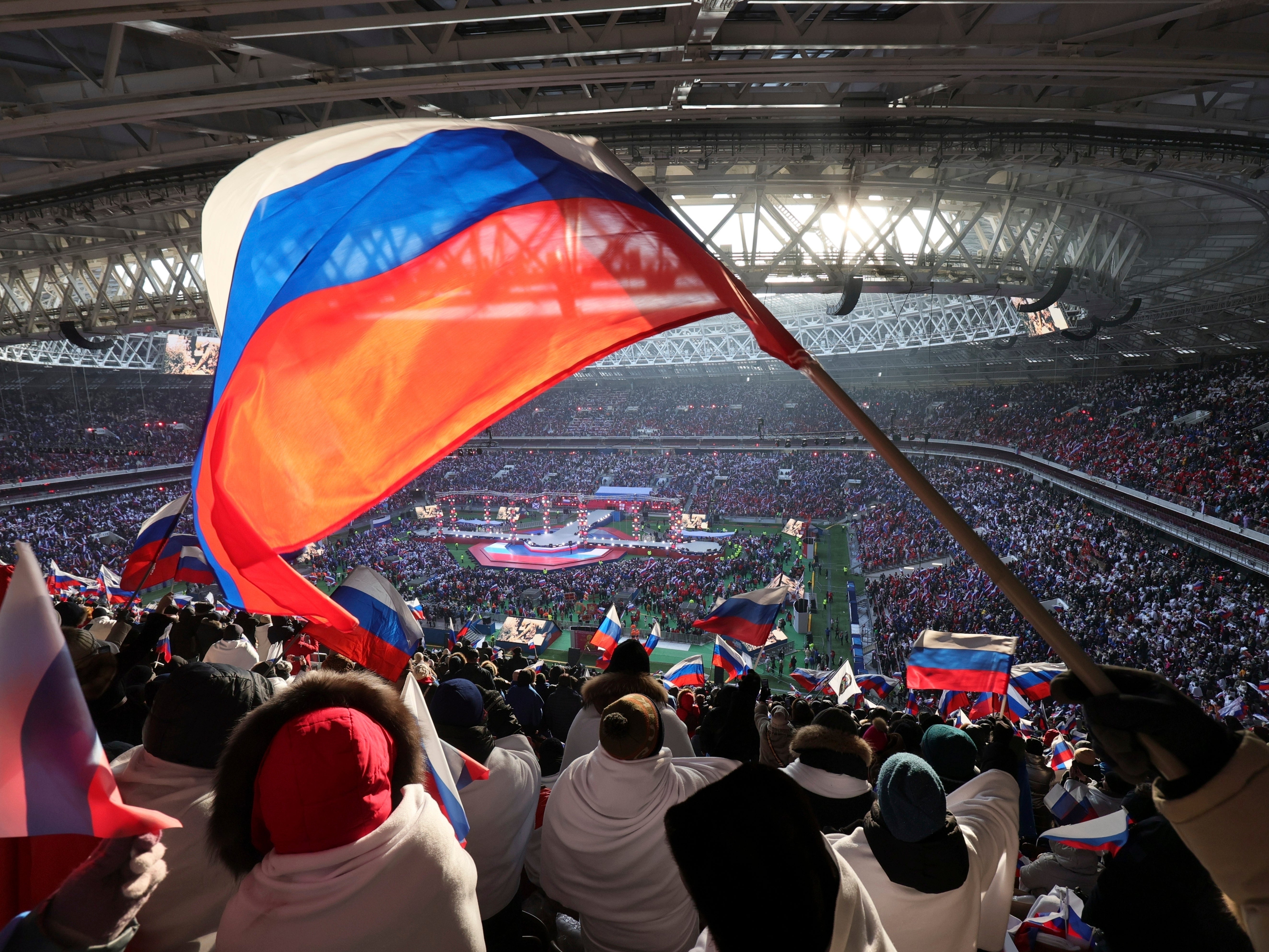 Flags are waved during a ‘Glory to the Defenders of the Fatherland’ concert in Moscow