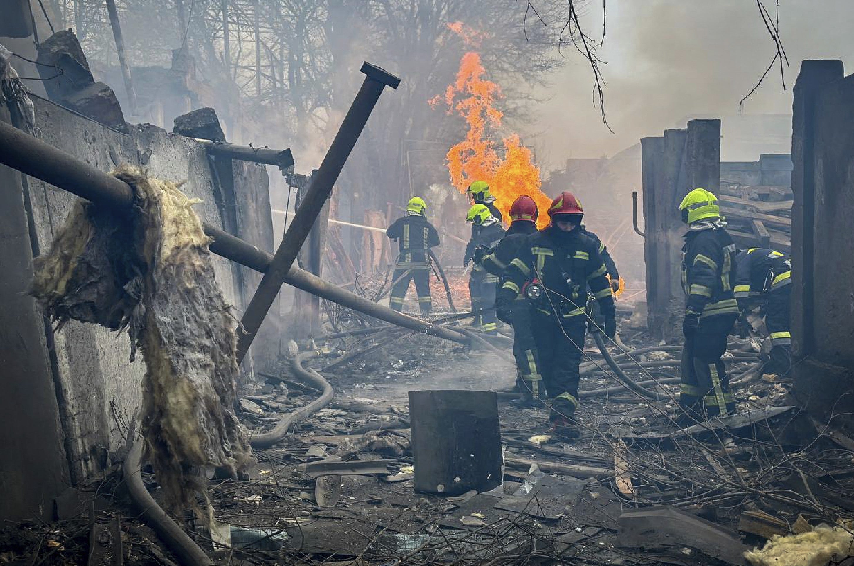 Rescuers extinguishing a fire at the site of the missile attack in Odesa on Friday