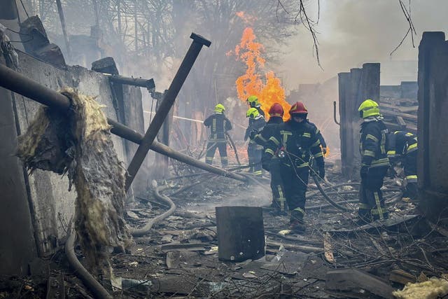 <p>Rescuers extinguishing a fire at the site of the missile attack in Odesa on Friday</p>