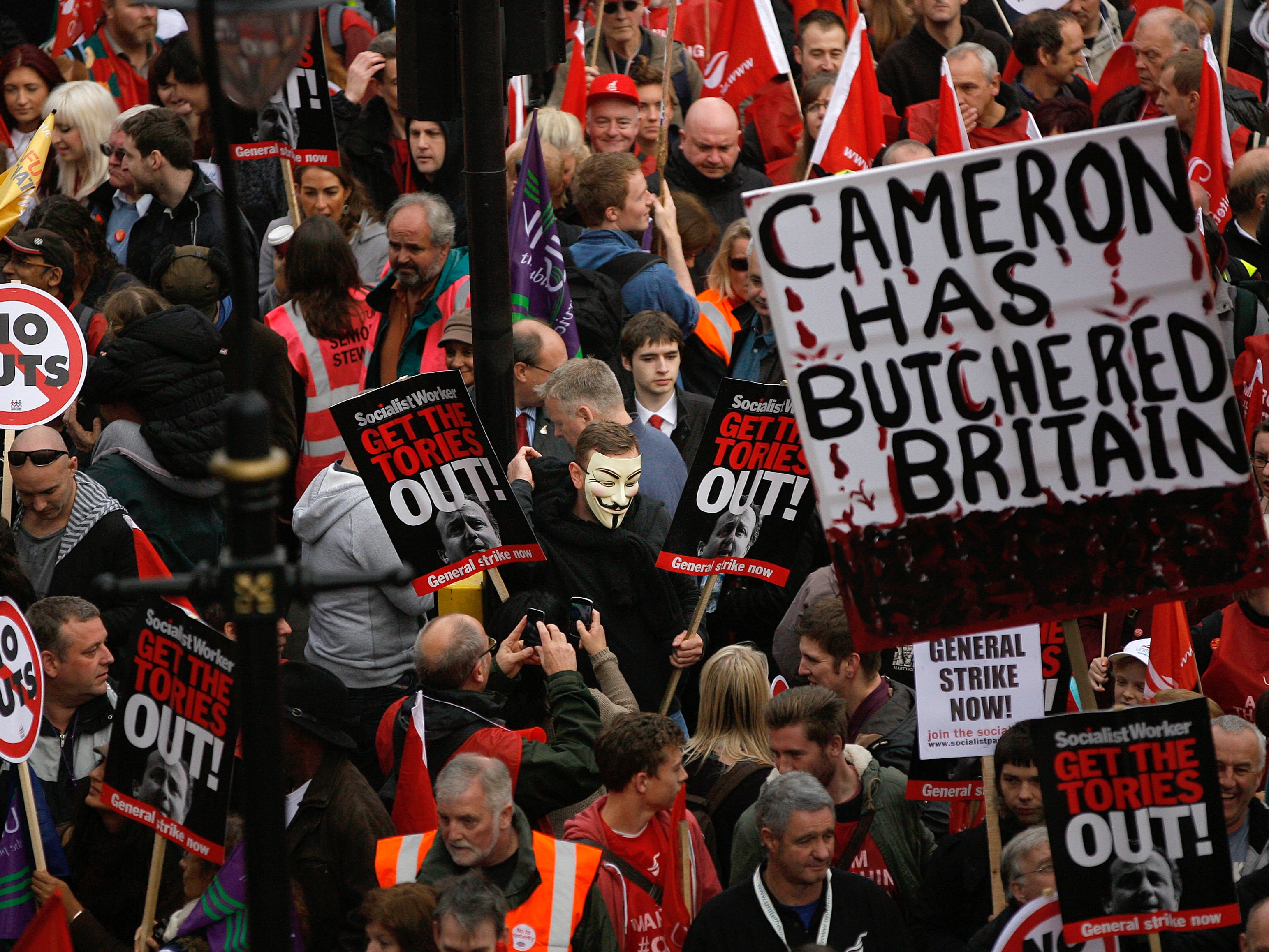 Demonstrators in London take part in a TUC march in protest against the government's austerity measures in 2012