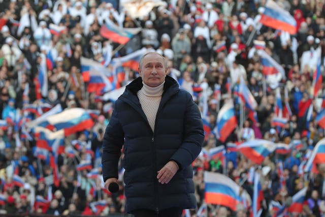 <p>Vladimir Putin attends a concert marking the eighth anniversary of Russia's annexation of Crimea at the Luzhniki stadium in Moscow on March 18, 2022</p>