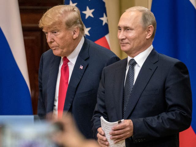 <p>US President Donald Trump, left, and Russian President Vladimir Putin arrive to waiting media during a joint press conference after their summit on July 16, 2018 in Helsinki, Finland. Both Trump and Moscow have denied claims in Bob Woodward’s new book “War” that Trump and Putin continued to communicate after the former left office in 2021 </p>