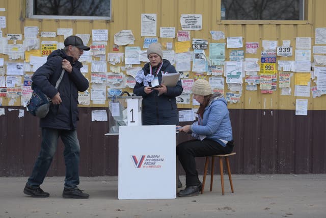 <p>eople cast their votes at a mobile polling station during early voting in Russia's presidential election in Russian-controlled part of Donetsk region, Ukraine</p>