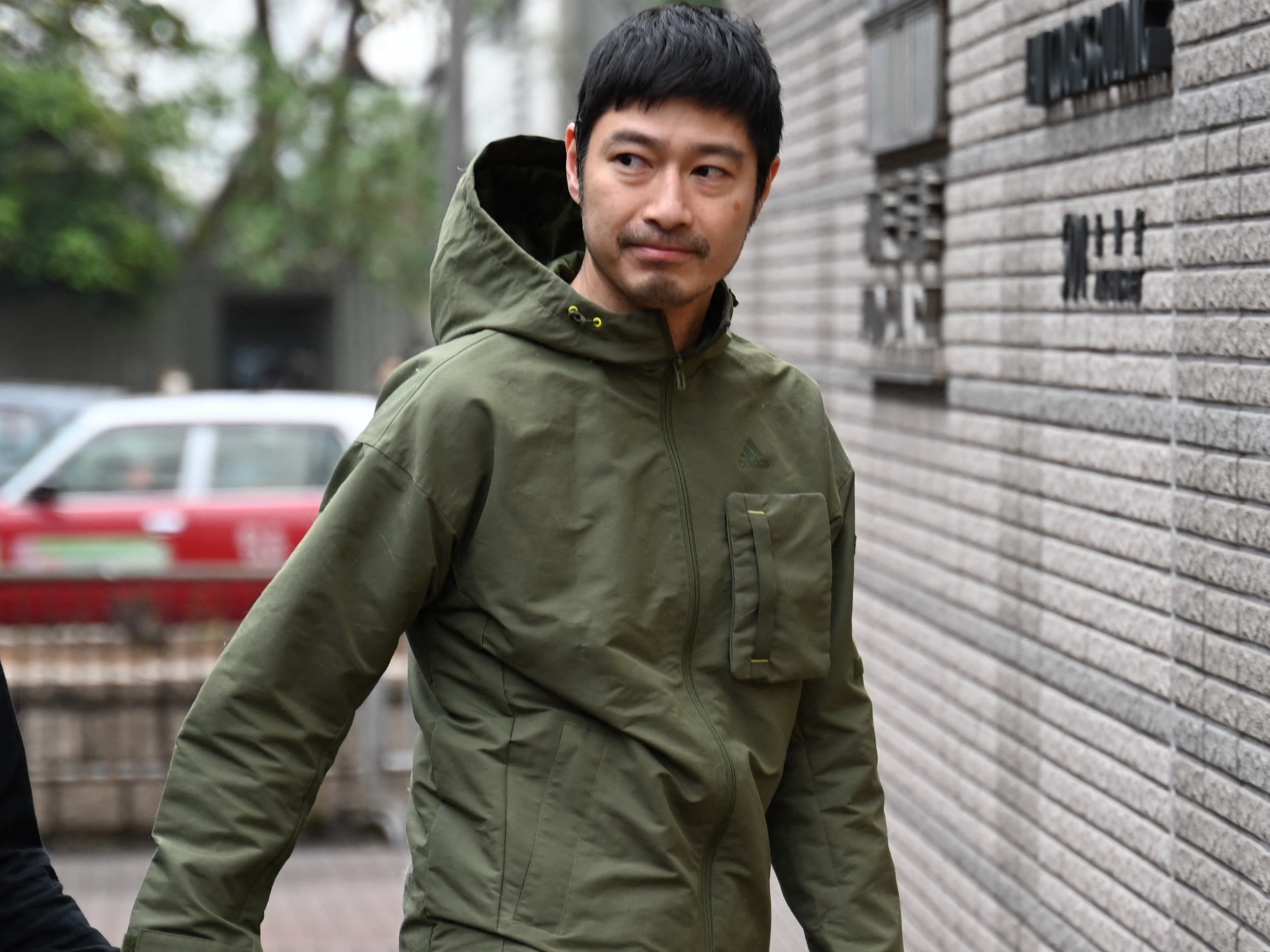 <p>Hong Kong actor Gregory Wong enters the West Kowloon court in Hong Kong</p>